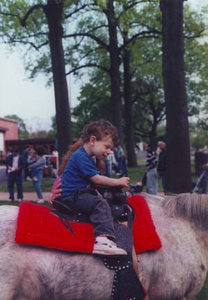 Louis takes a ride on a Horse