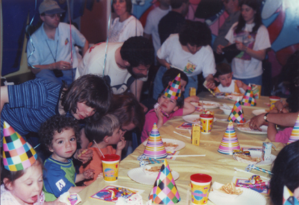 David Frankel on left in Blue, Abby Elis in Pink looking at Alan Elis, David Levy at head of table