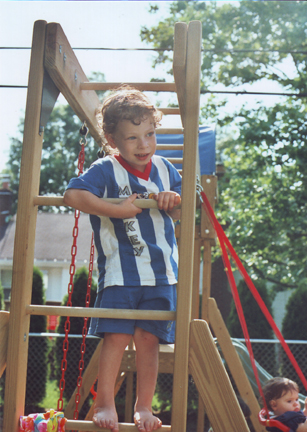 Louis and Aunt Carrie & Uncle Steve's new swing set, Cousin Allison lower right