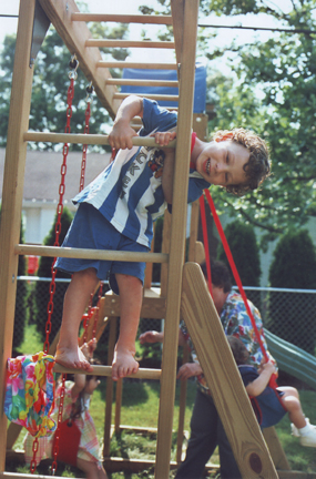 Louis and Aunt Carrie & Uncle Steve's new swing set, Grandma Renee lower right