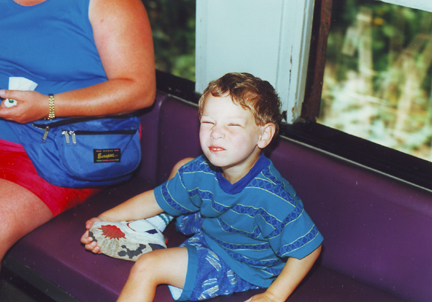 Louis has fun on the coach - Jill at left