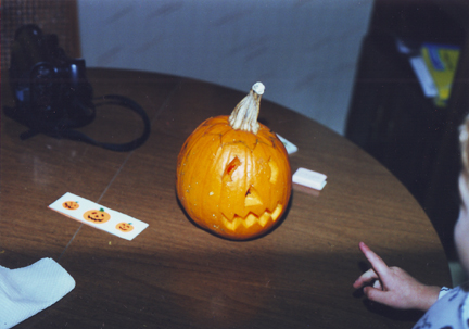 Pumpkin w lit candle inside