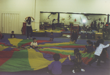 David Levy in middle being prepared for a lifting