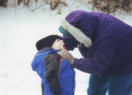 Jill checks Louis for loose tooth.