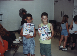 Louis & Justin M Showing off Year Books