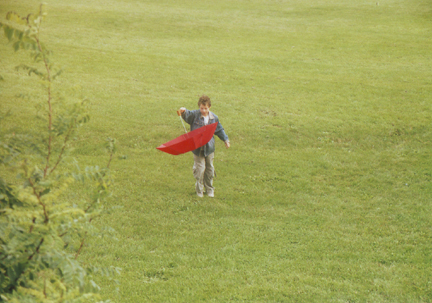 Louis play wth an unbrella