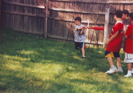 Drew F takes a swing w Louis, Blase S & Justin M watching