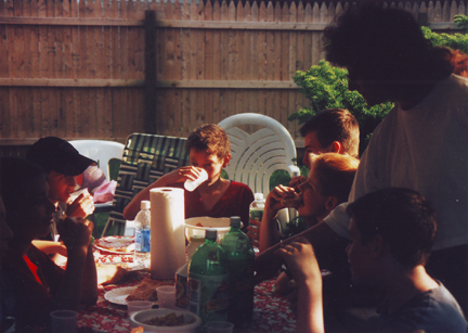 Louis Center with friends around.  Aunt Carrie standing on right.